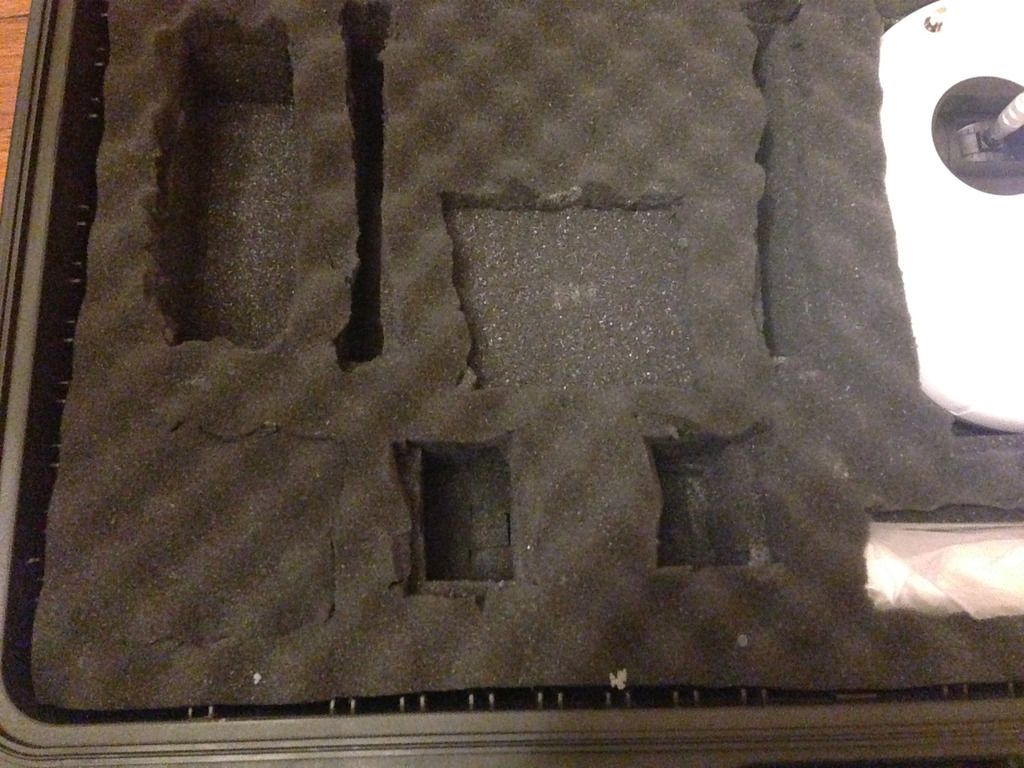 Lower left showing charger slot, leg slots, cut out for gopro mount and two battery slots. Also a small covered section (see next but one pic). Note that I put the batteries in cables down when charged and cables up when used